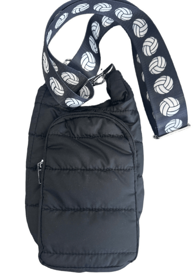 Black puffer bag with a patterned volleyball purse strap on a white background